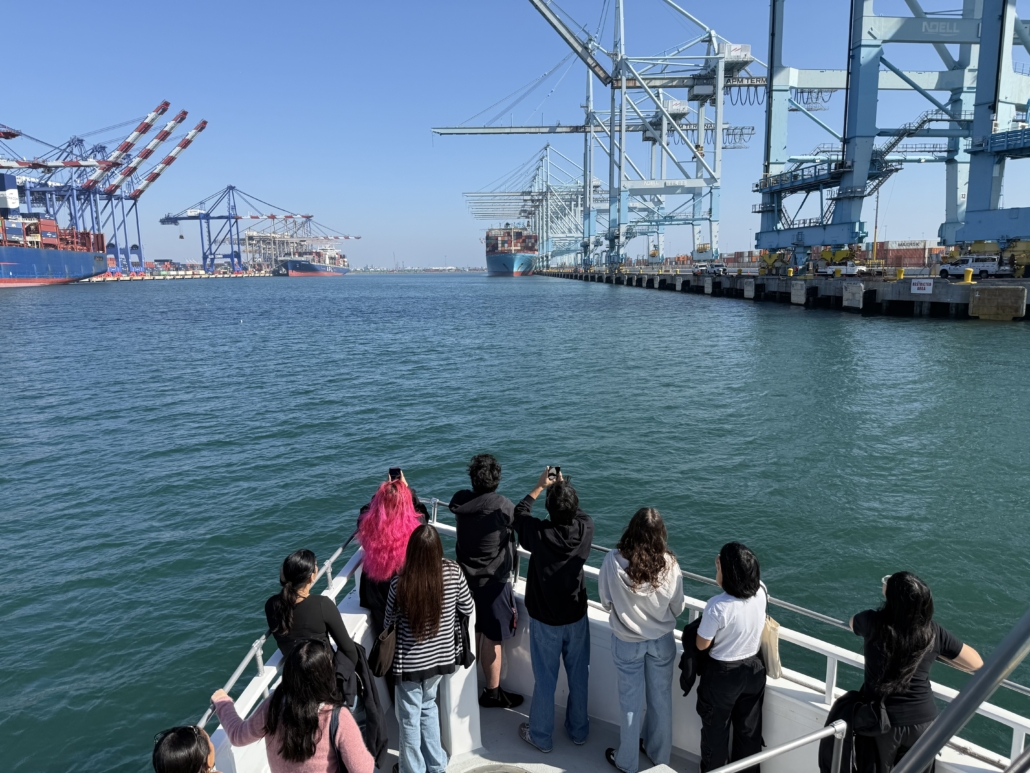 Students taking pictures of the LA port on a boat